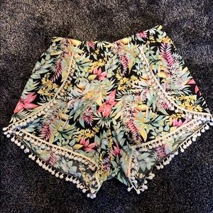 Black flower print shorts.